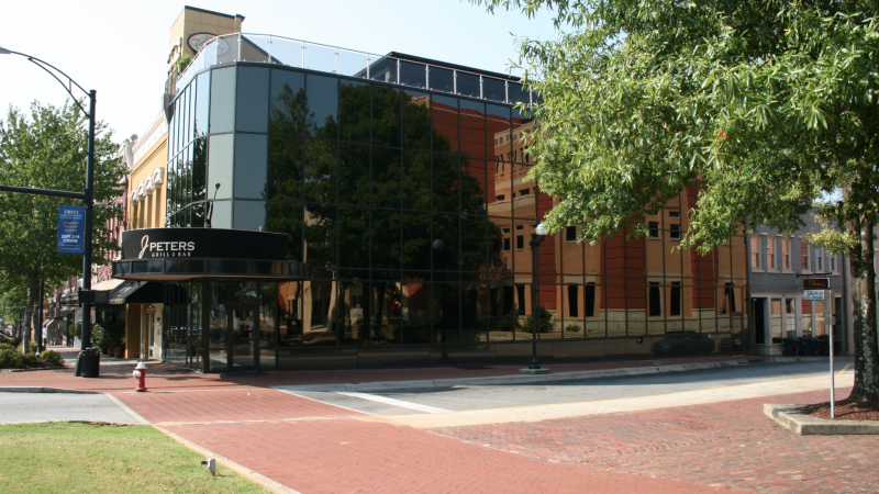 Glass building construction J Peters Downtown Anderson - side view