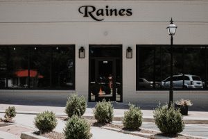 outside entrance of raines complete