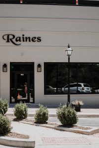 outside entrance of raines complete