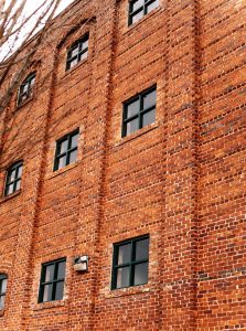 Windows on large commercial brick building